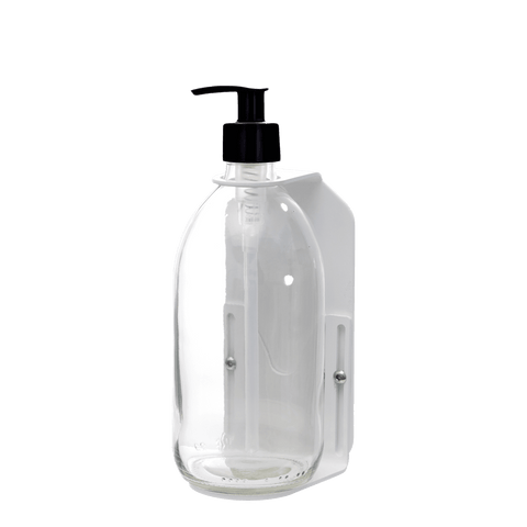 White wall mounted soap dispenser clear bottle and plastic pump
