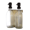 Gold double wall mounted dispenser with clear bottles and black pump