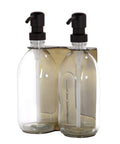 Gold double wall mounted dispenser with clear bottles and black pump