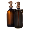 gold double wall mounted holder with amber bottle and copper pumps