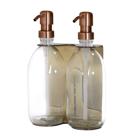 Gold double wall mounted dispenser with clear bottles and copper pump