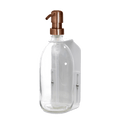White wall mounted soap dispenser clear bottle and copper pump