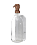 White wall mounted soap dispenser clear bottle and copper pump