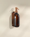 Shower wall mounted soap dispenser in copper