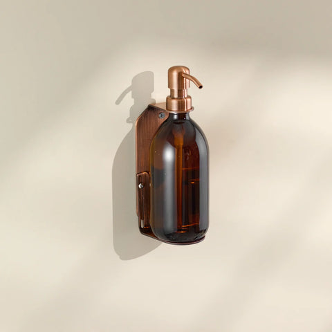 Shower wall mounted soap dispenser in copper