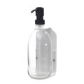White wall mounted soap dispenser clear bottle and black pump