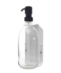 White wall mounted soap dispenser clear bottle and black pump