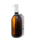 White wall mounted soap bottle